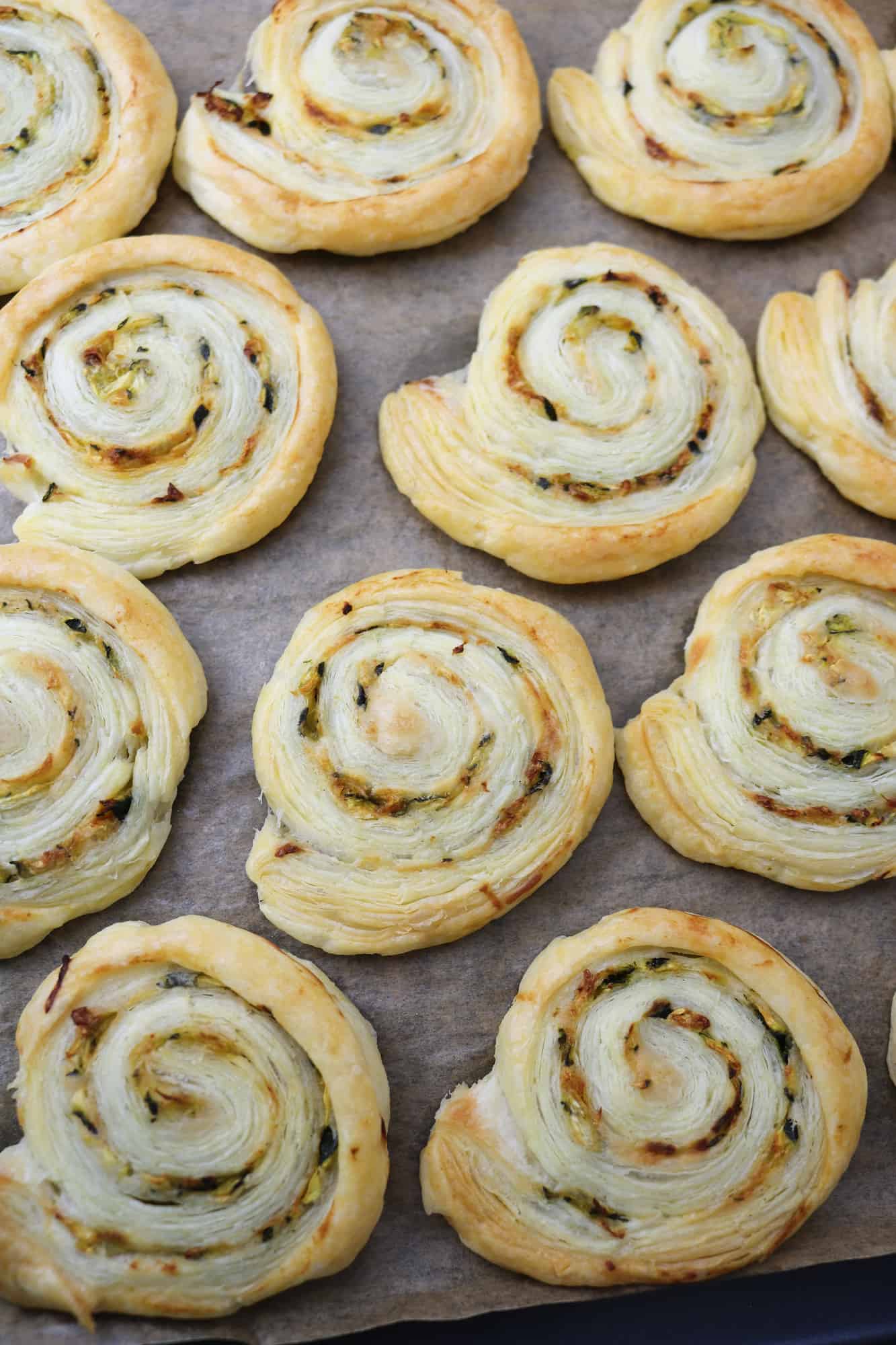 vegan courgette and smoked paprika pastry rolls on tray after bake