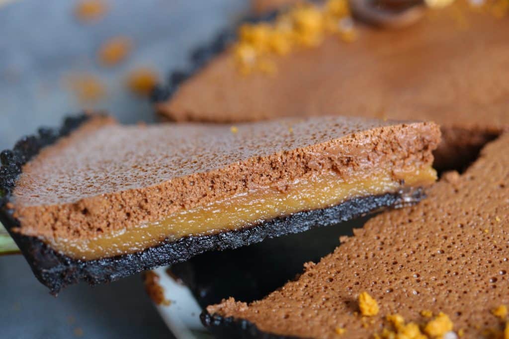 Slice of Chocolate Mousse and Biscoff Tart to show the layers