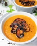 This roasted pumpkin soup with mushroom "bacon" bits close up