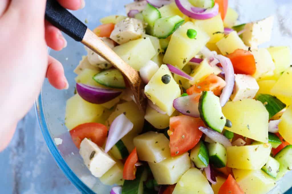 mixing italian potato salad
