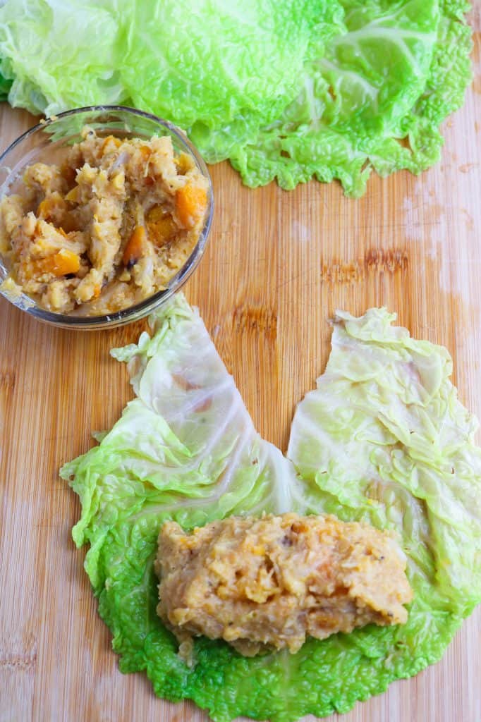 filling the cabbage leaves for Savoy Cabbage Rolls with Butternut Squash and Red Lentils