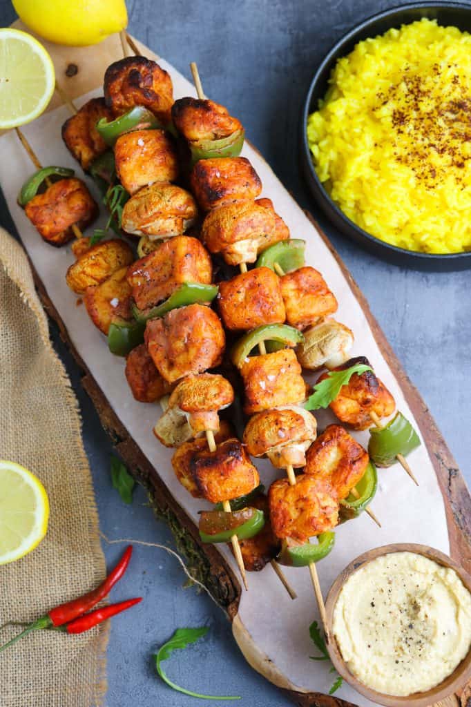 Tofu Puff Skewers with saffron rice, lemon wedges and hummus