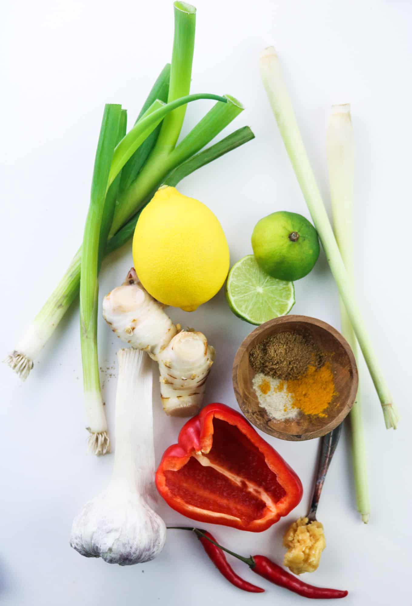 ingredients to prepare Vegan Thai Red Curry Paste on a white table