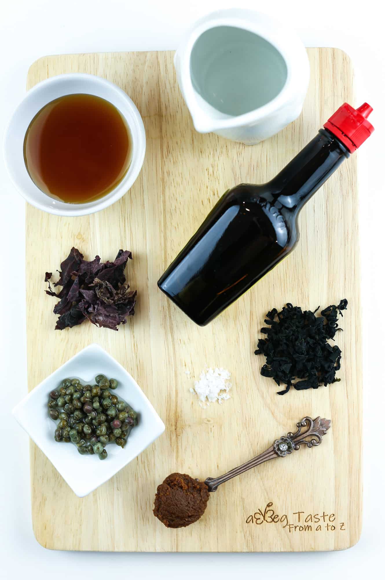 ingredients for the vegan fish sauce on a wooden chopping board