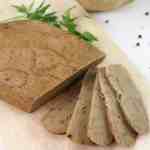 Turkey(less) loaf, vegan meat alternative that is also suitable for your gluten and soy free guests sliced on a wooden board