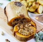 Vegan Roasted Butternut Squash: Sweet and herby roasted squash filled with a generous and fragrant plant mince, accompanied by a flavourful sage and white wine gravy, will be the absolute star of your Thanksgiving or Christmas table. #holiday #veganmain #thanksgiving #recipeinspo #plantbased #christmasmain #roastedsquash