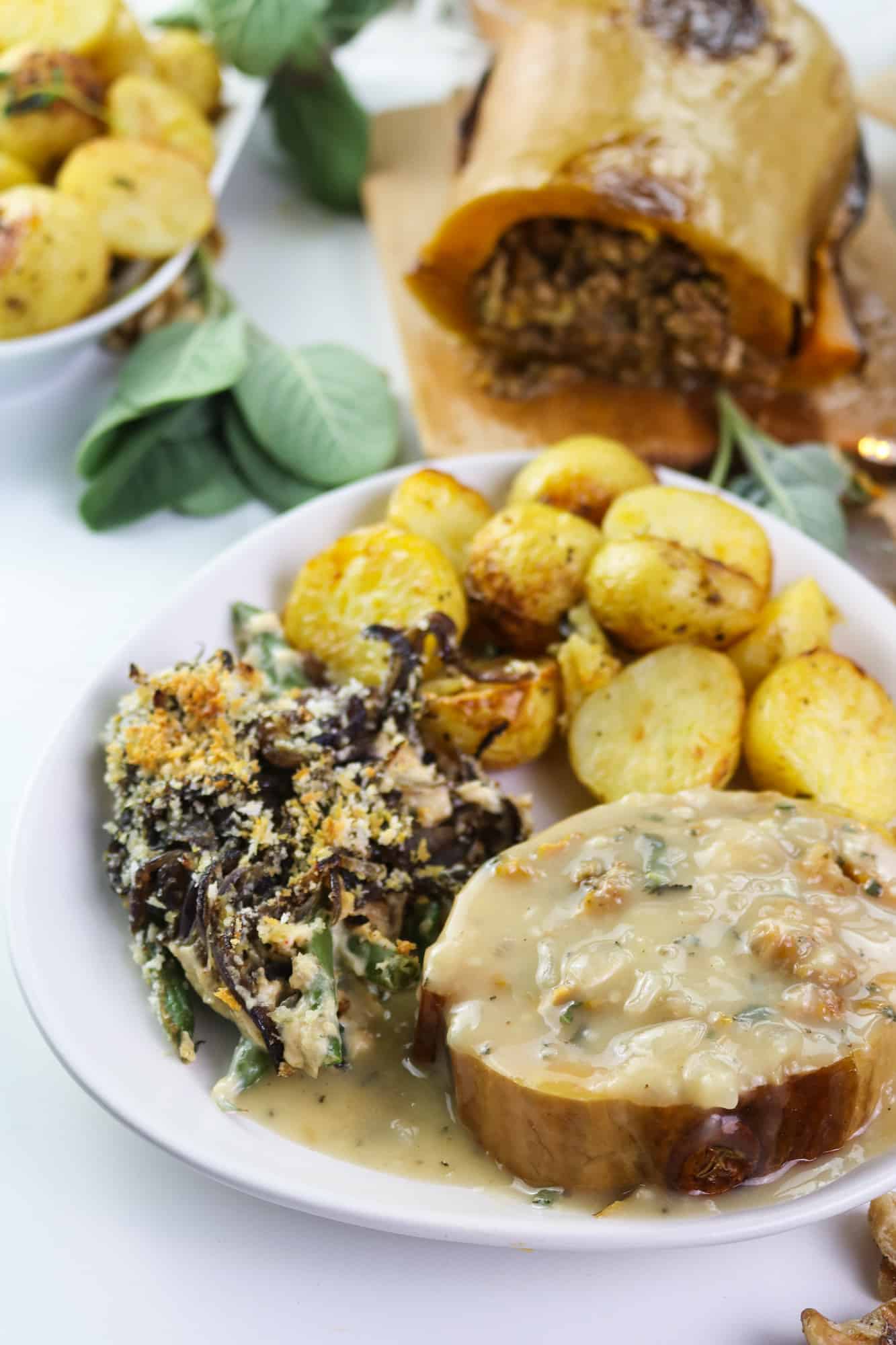 Vegan roasted butternut squash served with roasted potatoes and green bean casserole