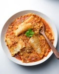 lasagna soup bowl with wooden spoon served