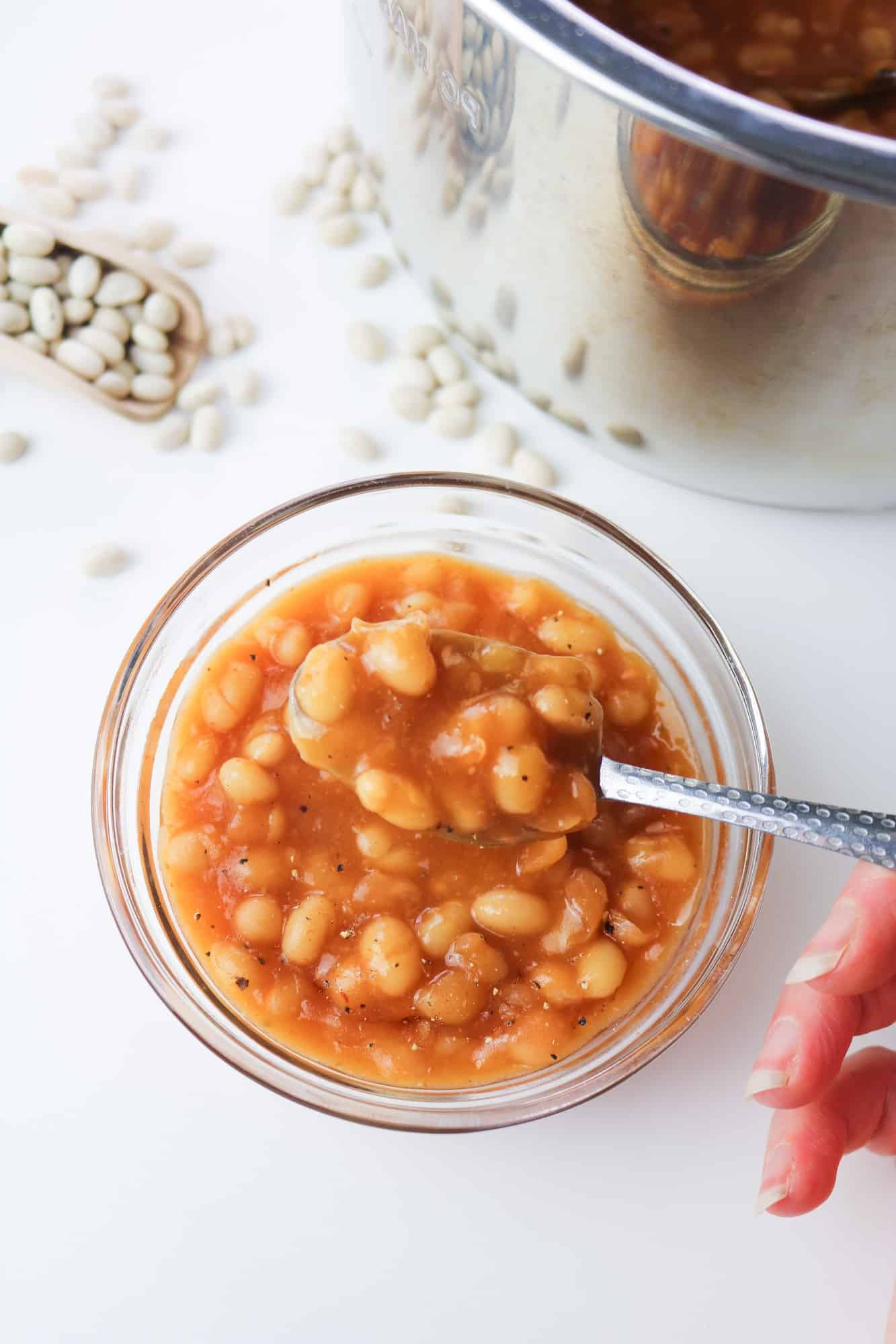baked beans served in a bowl spoonful