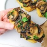 polenta bruschetta with mushrooms held