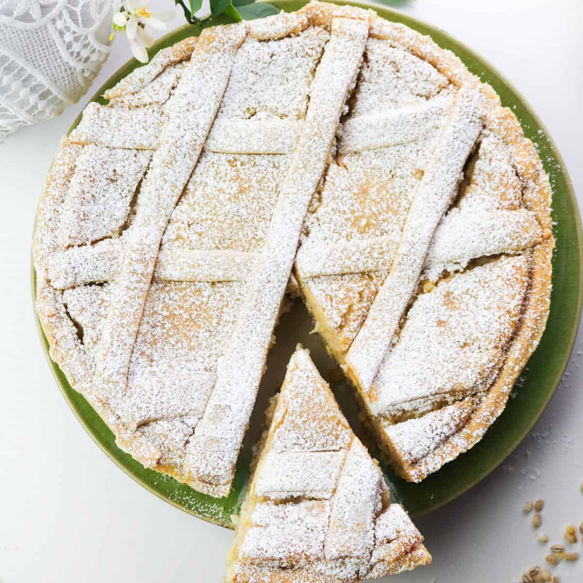 vegan pastiera napoletana with slice cut out of the pie