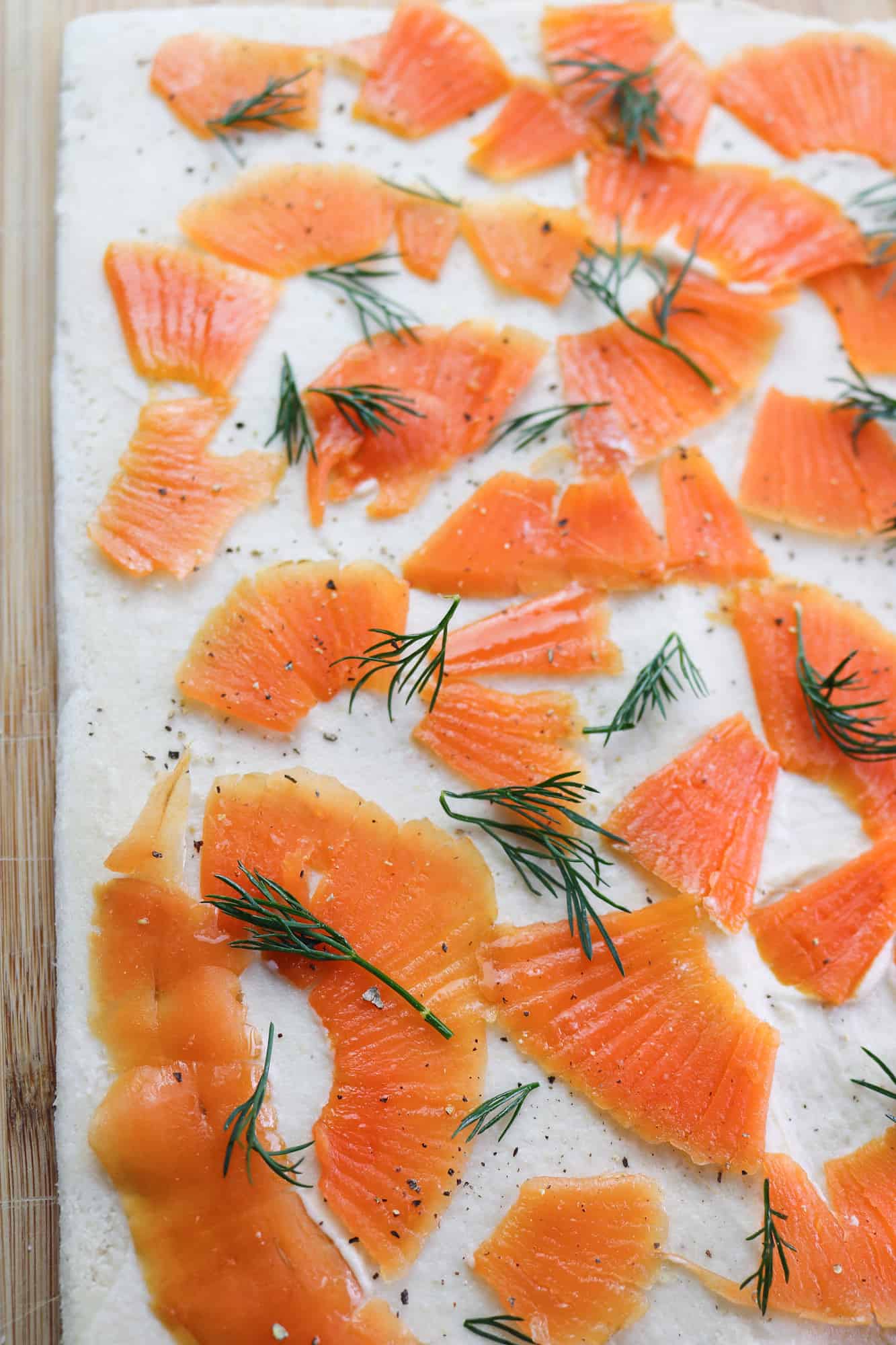 vegan salmon and cashew cheese on flattened bread with toppings