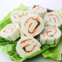 vegan salmon and cashew cheese pin wheels on a serving plate