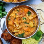 mangalorean roasted cauliflower curry served in a traditional Indian bowl
