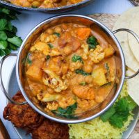 mangalorean roasted cauliflower curry served in a traditional Indian bowl