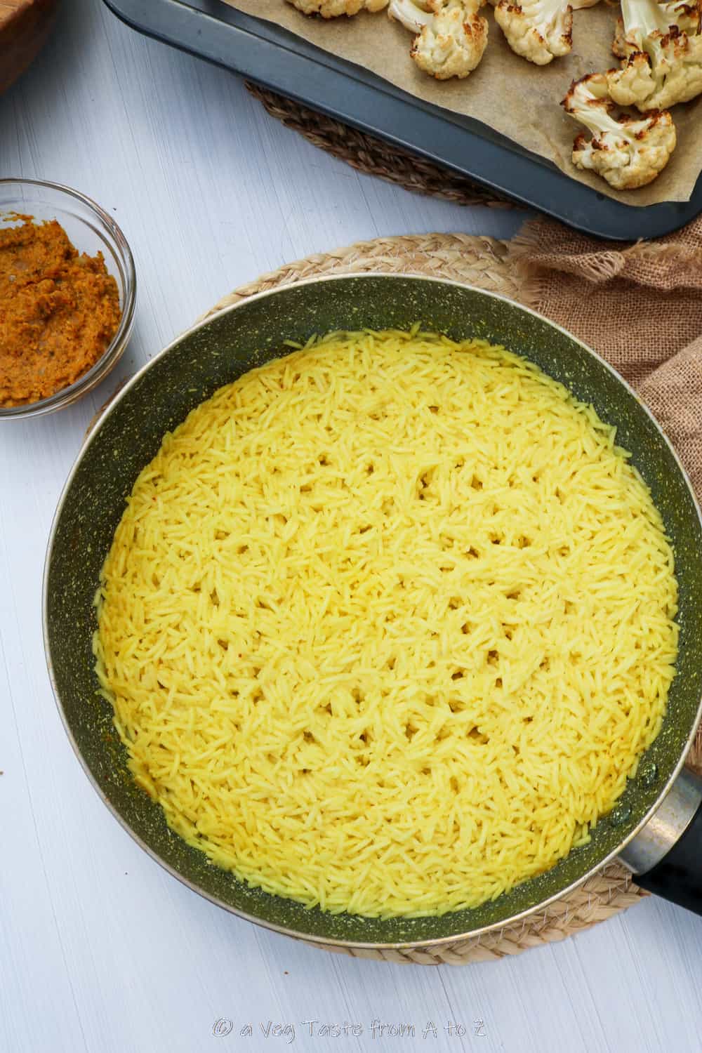 cooked yellow rice in a pan