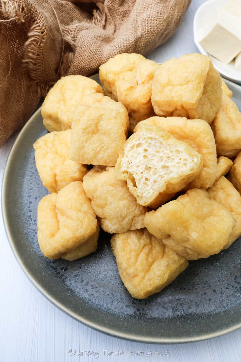 interior of how to make tofu puffs (puffed tofu/deep fried tofu) on grey plate