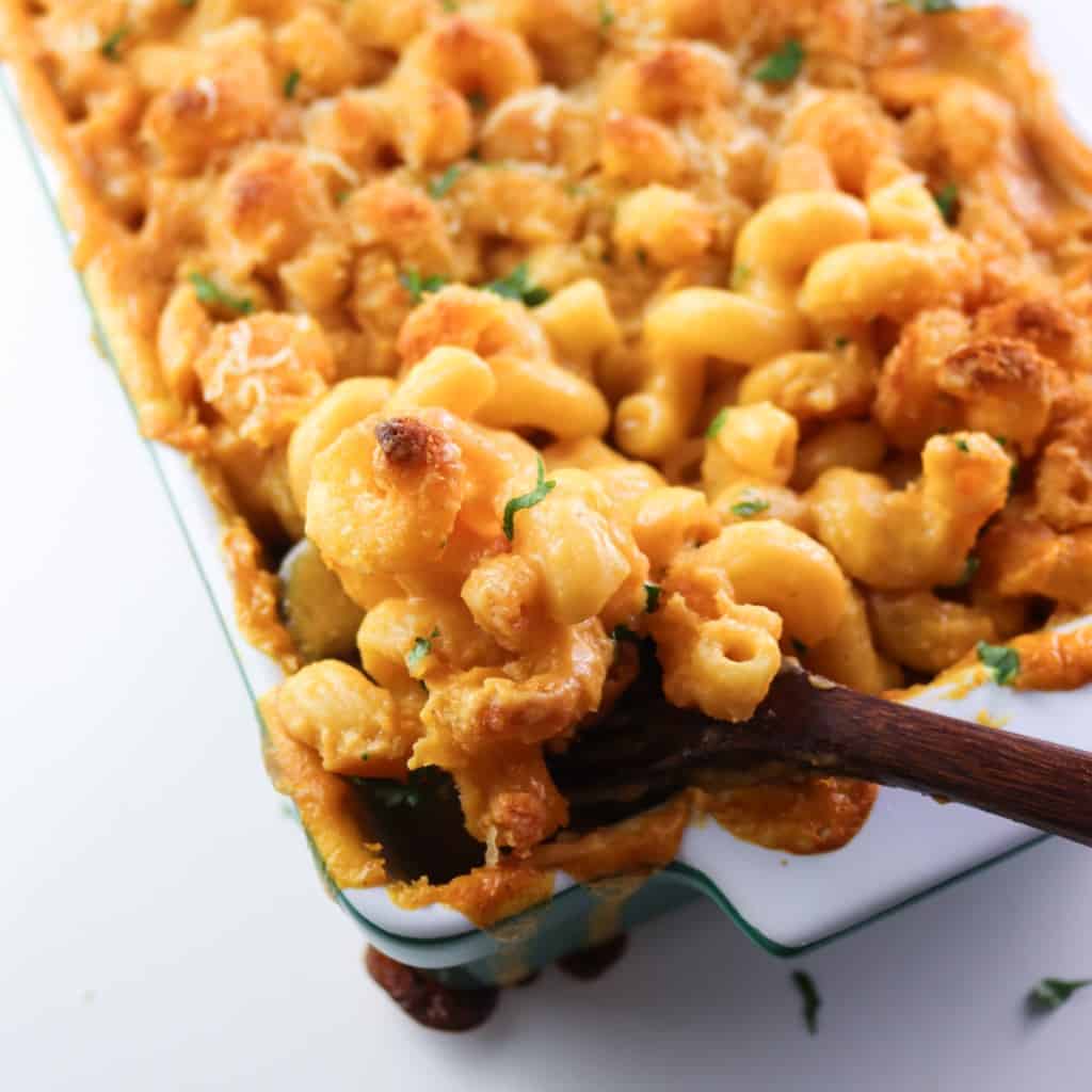 mac and cheese in a tray with sponful