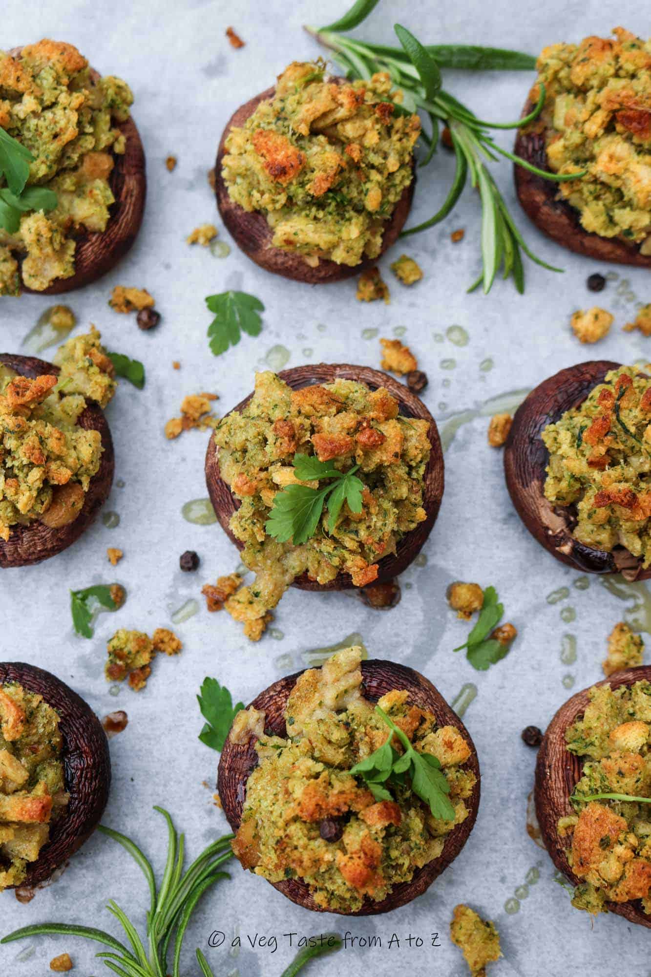 garlic bread mushrooms post bake in a tray with fresh herbs