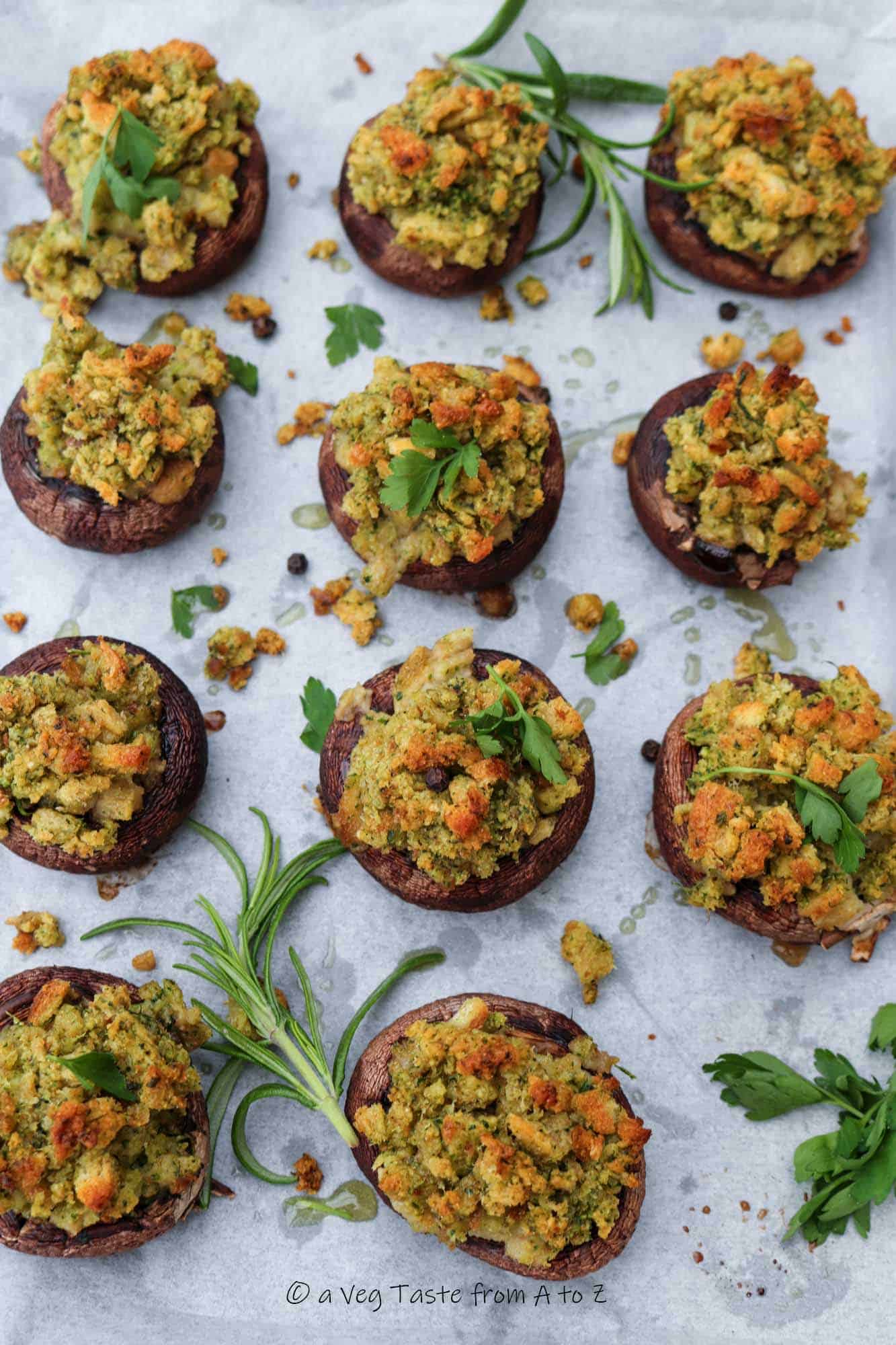 garlic bread mushrooms post bake in a tray with fresh herbs