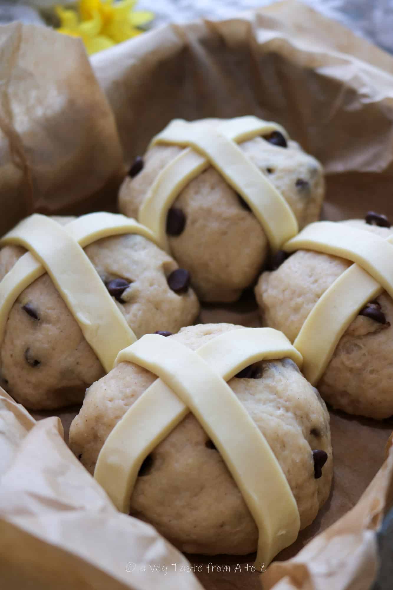 buns topped with pastry cross pre bake
