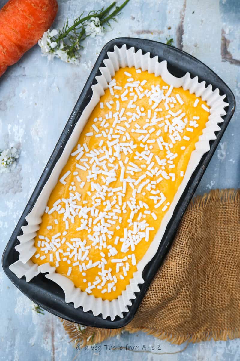 raw carrot cake with sugar sprinkles ready for the oven
