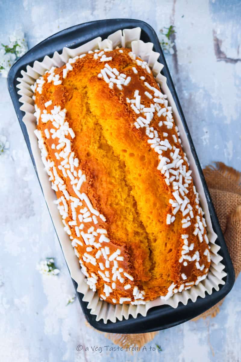 italian style carrot cake just out of the oven topped with sugar tails 