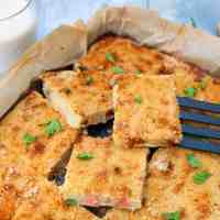 potato gateau cut in squares in a tray