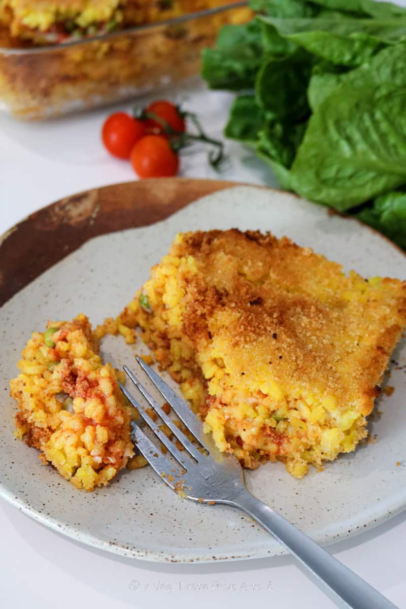 arancini bake in plate with fork